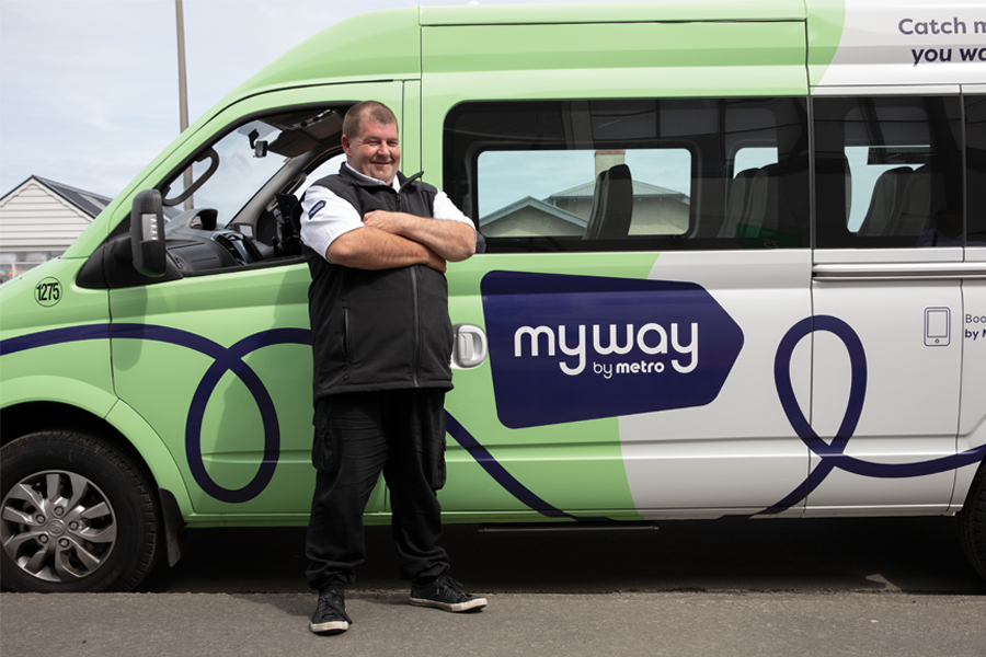 driver standing infront myway vehicle